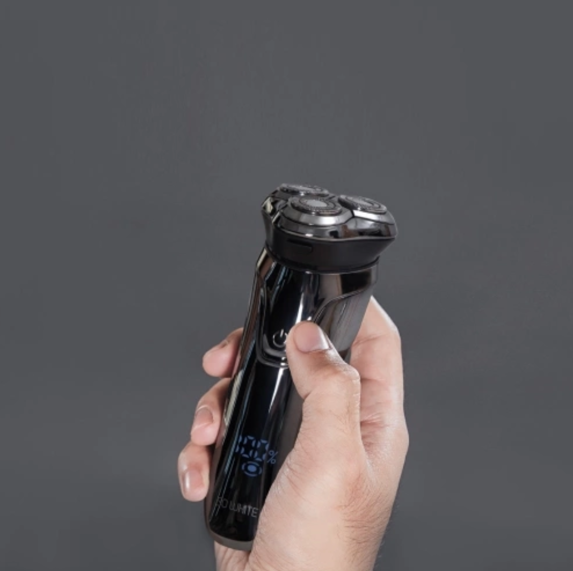 hand holding electric shaver