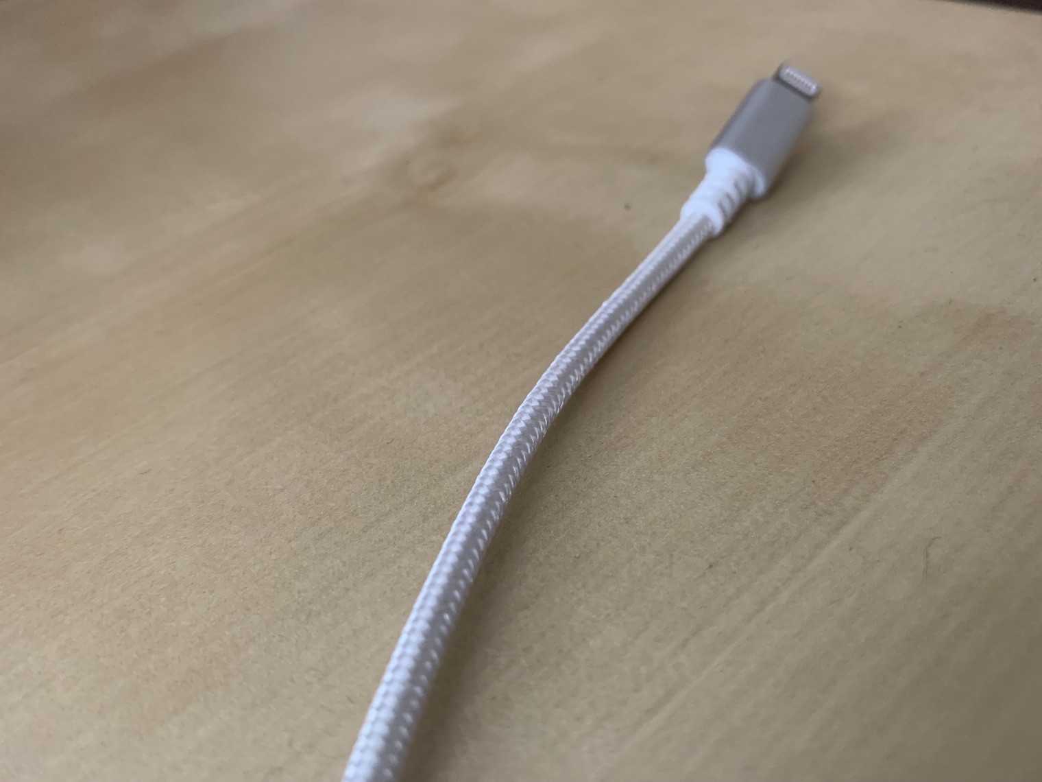 lightning cable on table