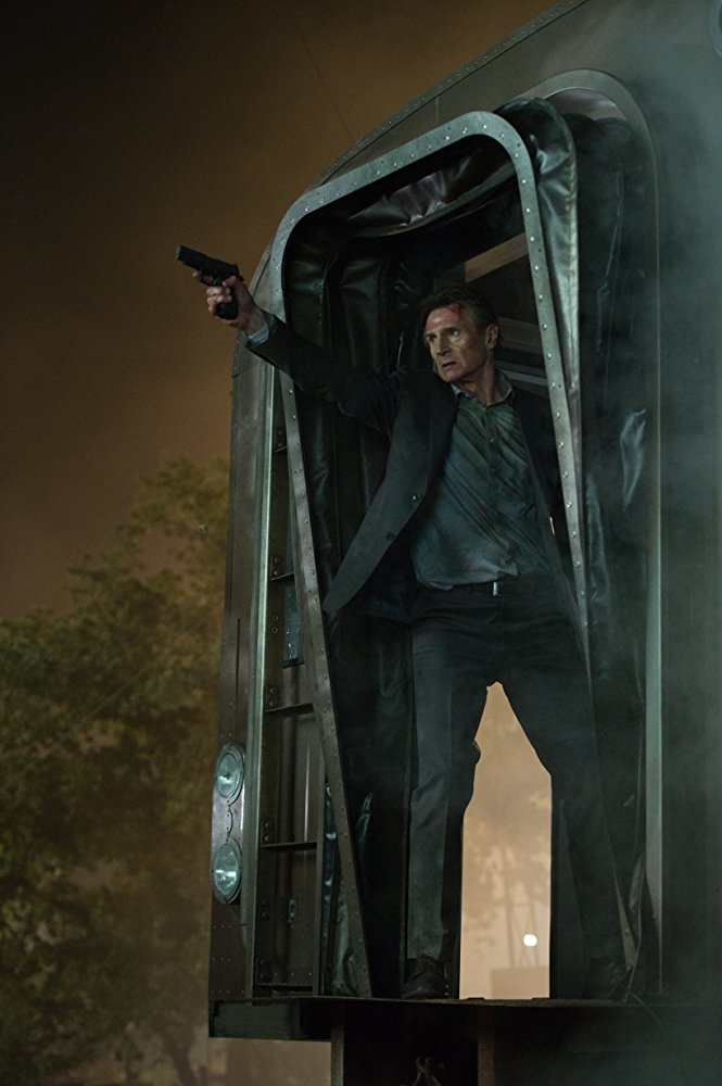 man with gun on train