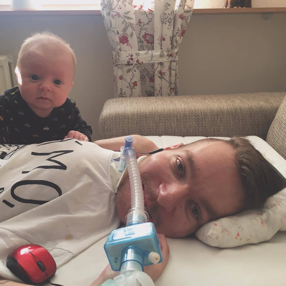 person with baby and ventilator