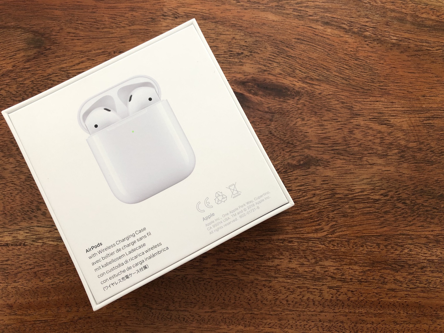 airpods box on wooden table