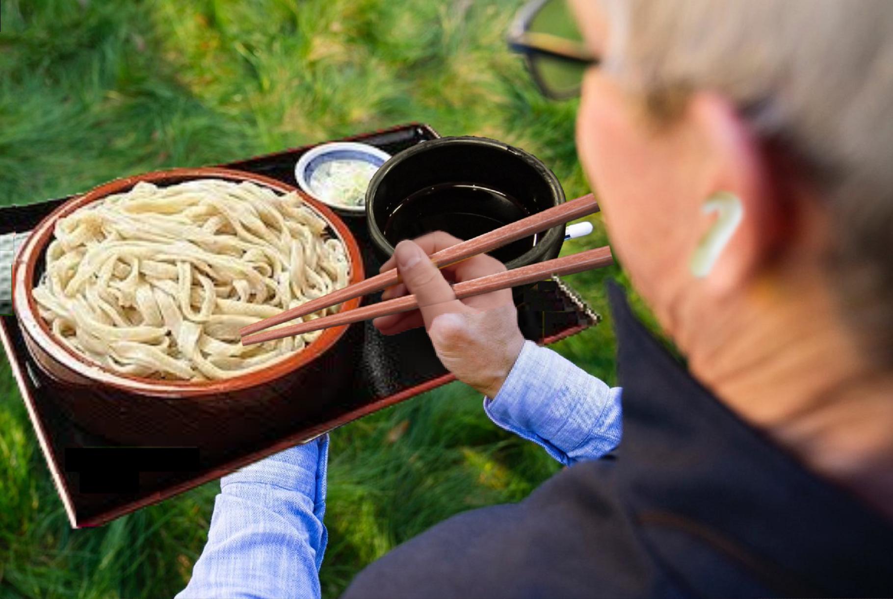 person eating noodles