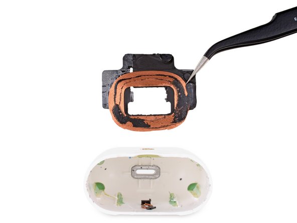 tweezers holding copper coil