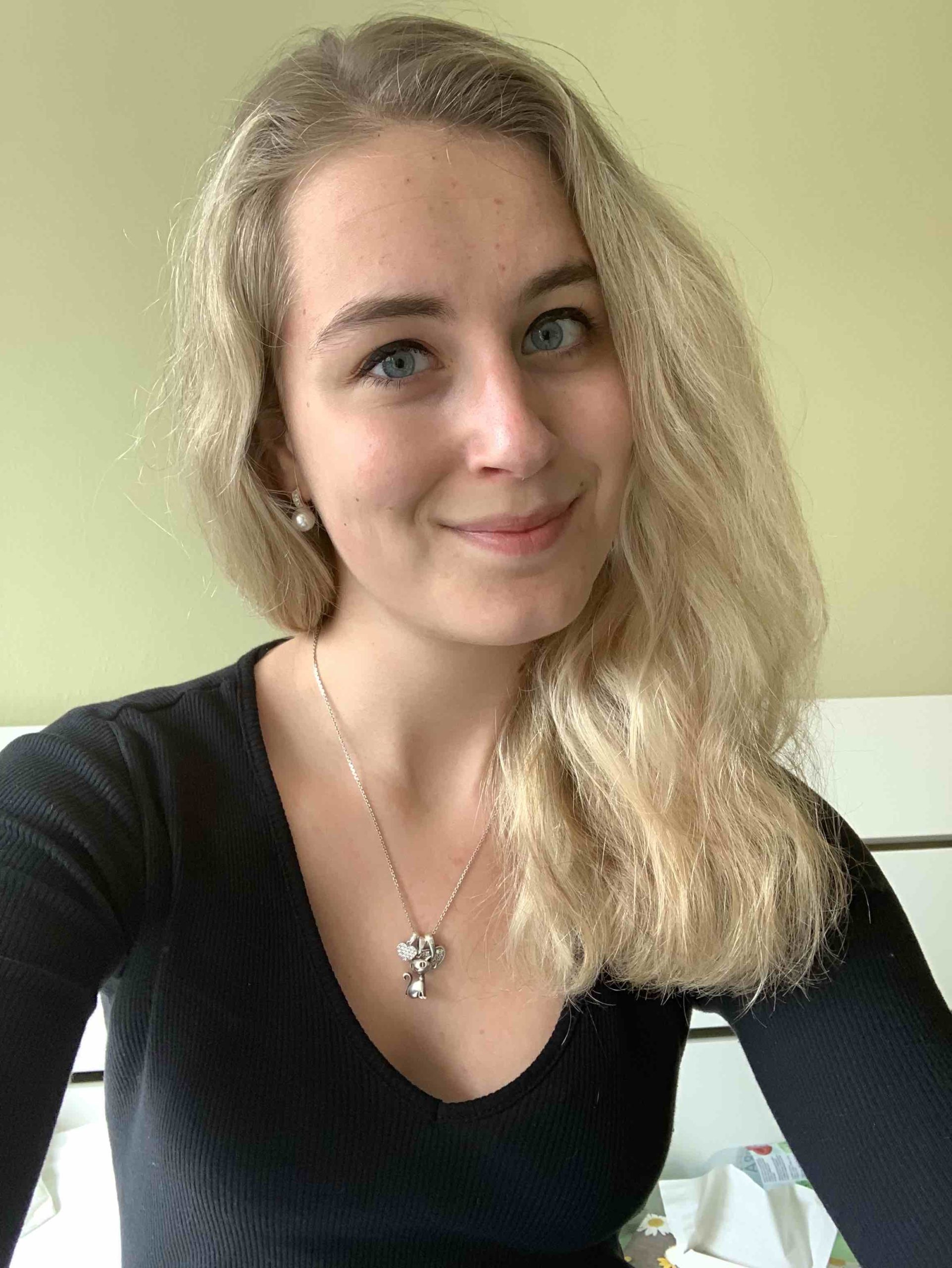 blonde woman necklace indoor portrait