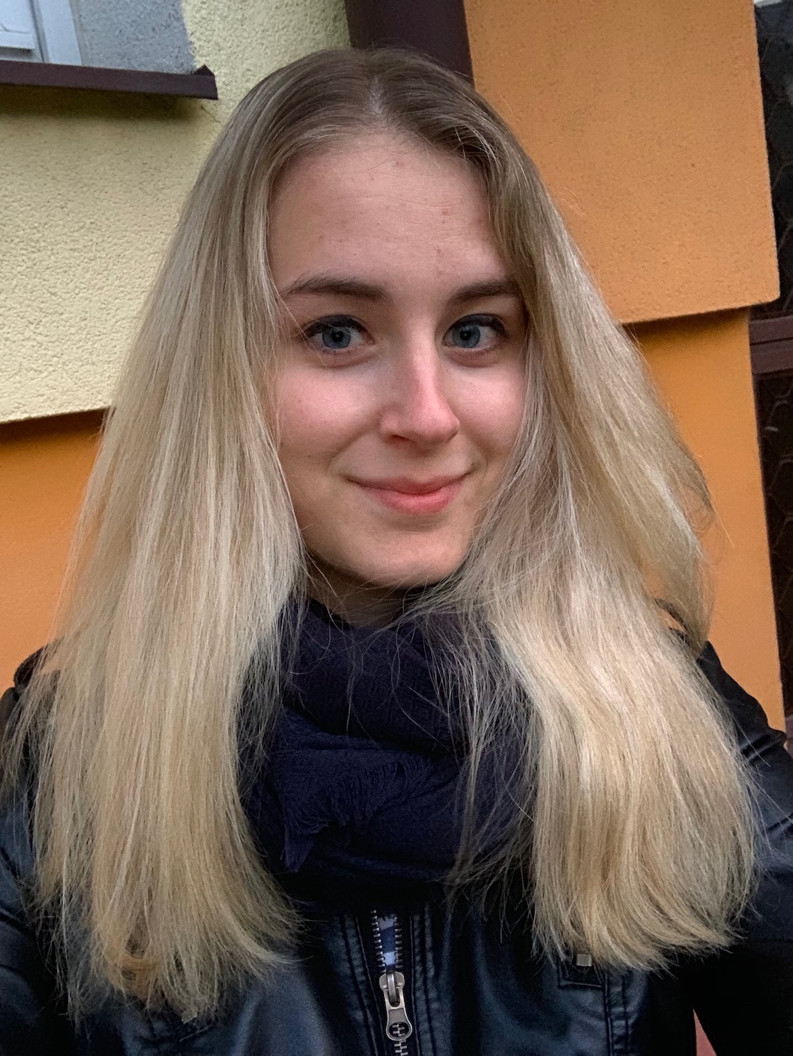 person smiling outdoors