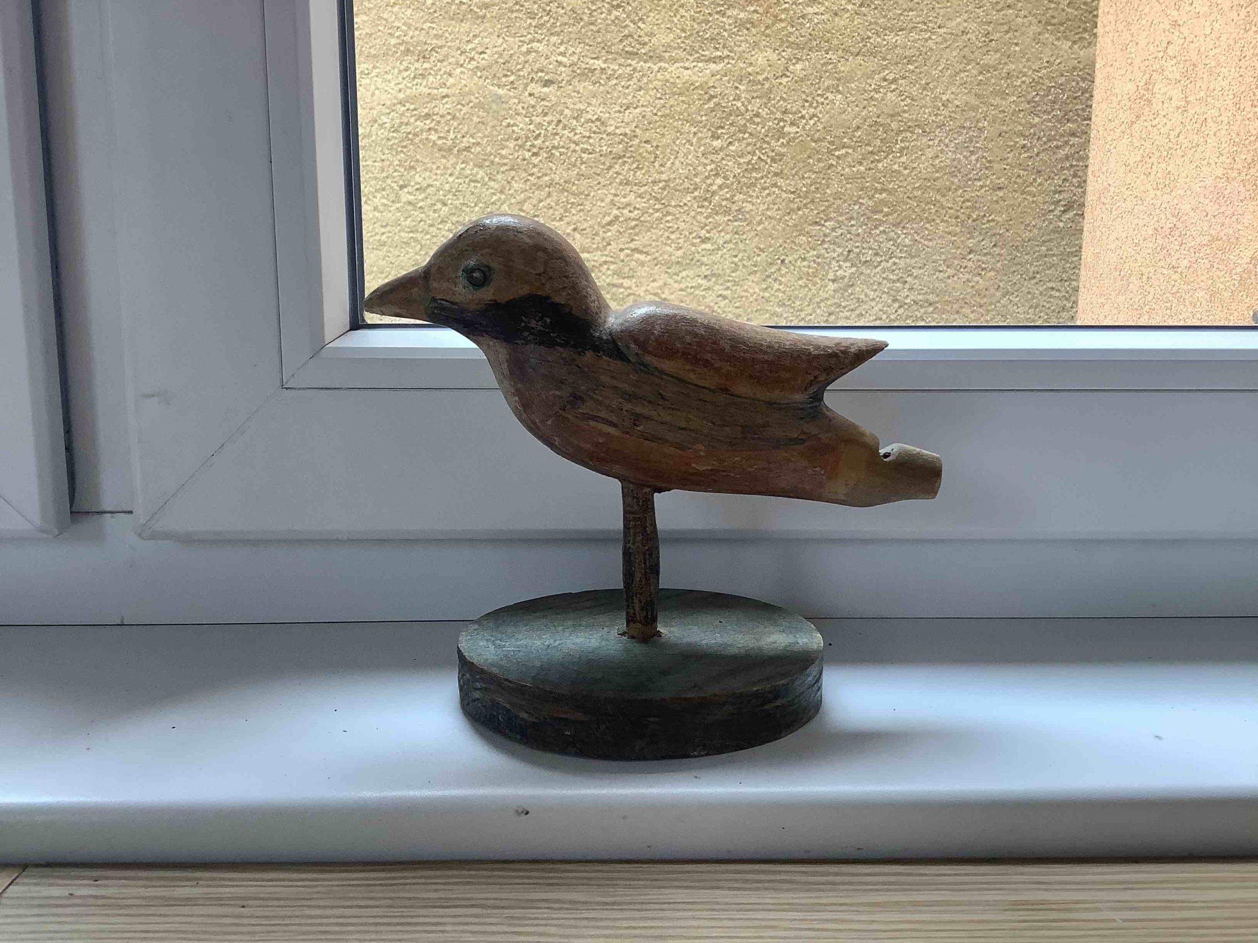 wooden bird figurine