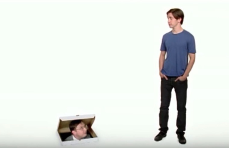 person in box next to standing person