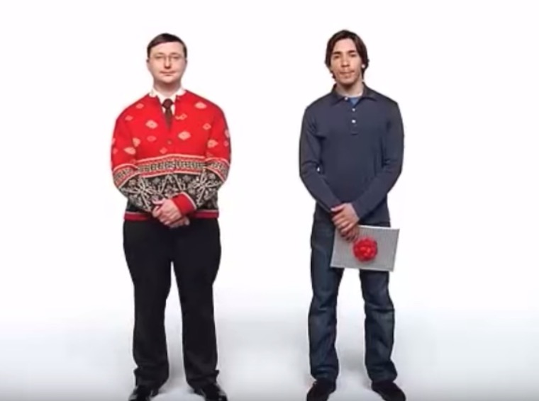 two men standing different outfits