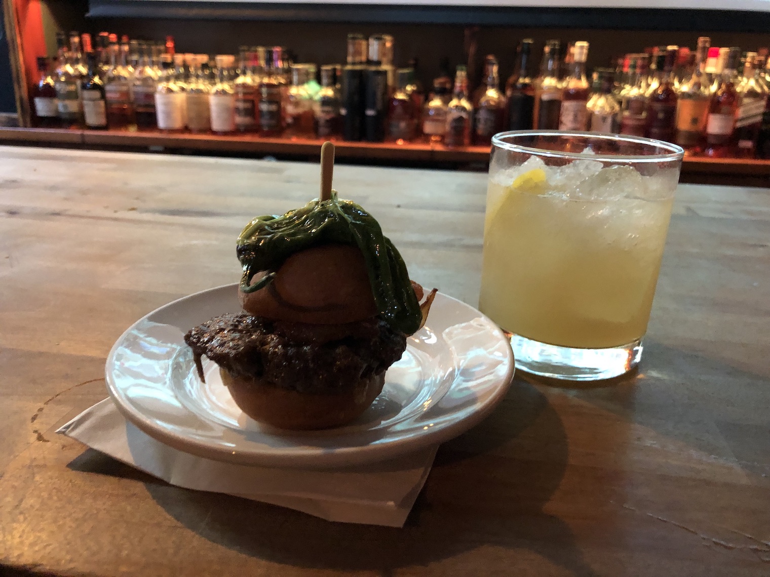 burger and cocktail on bar