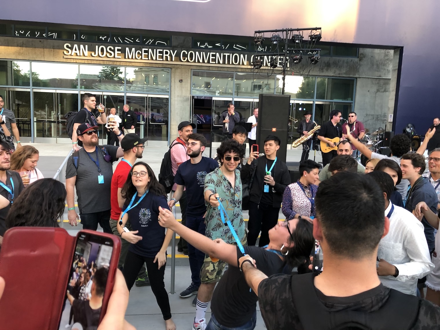 people gathering outside convention center