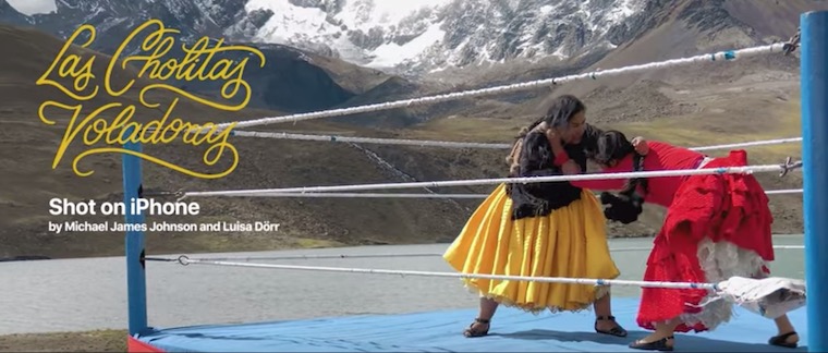 women wrestling mountain backdrop