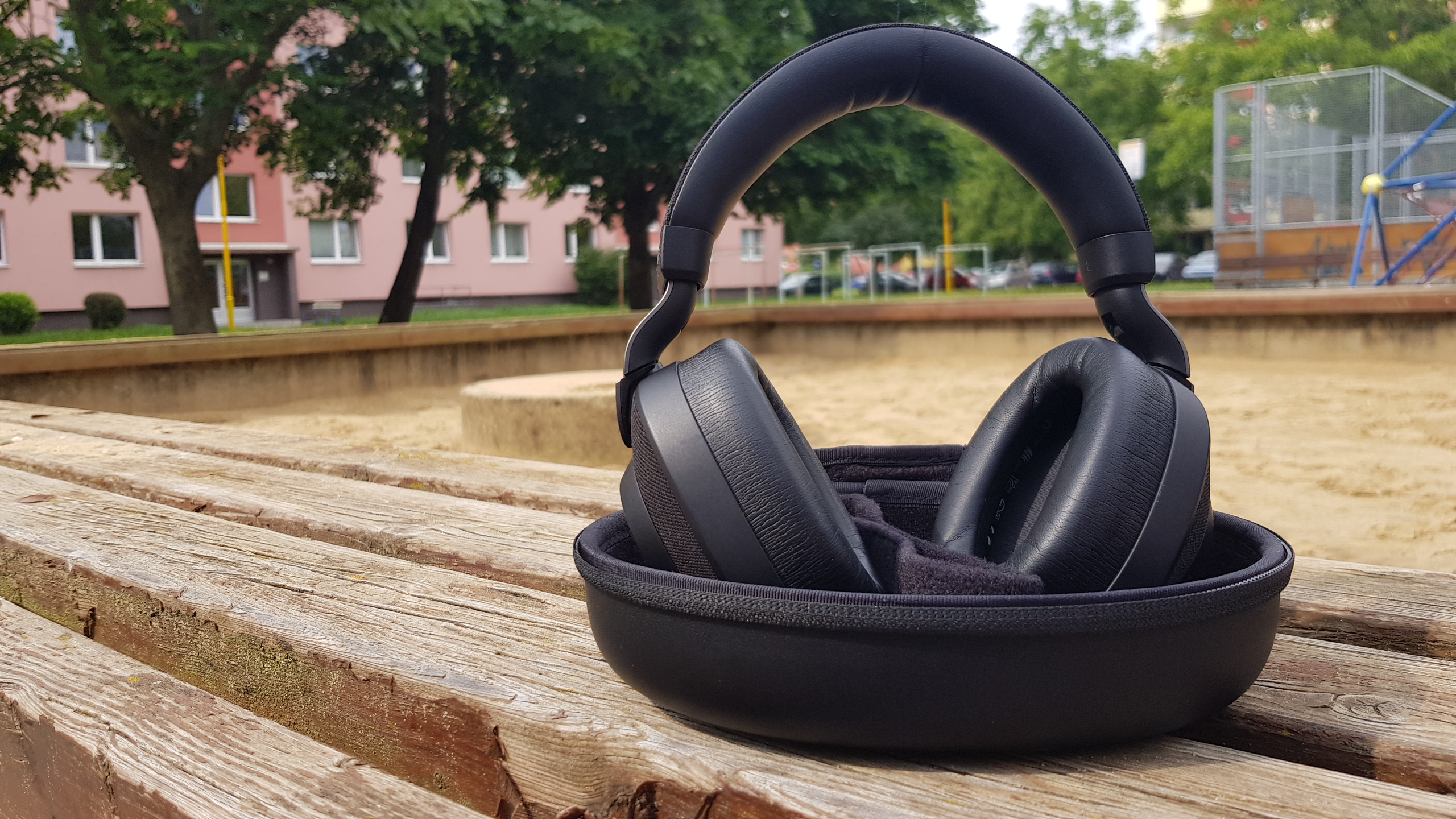 headphones on wooden bench