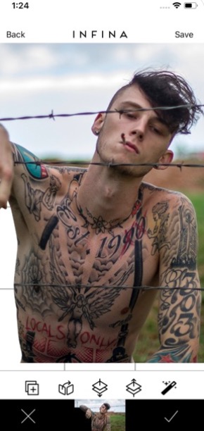 man with tattoos and barbed wire