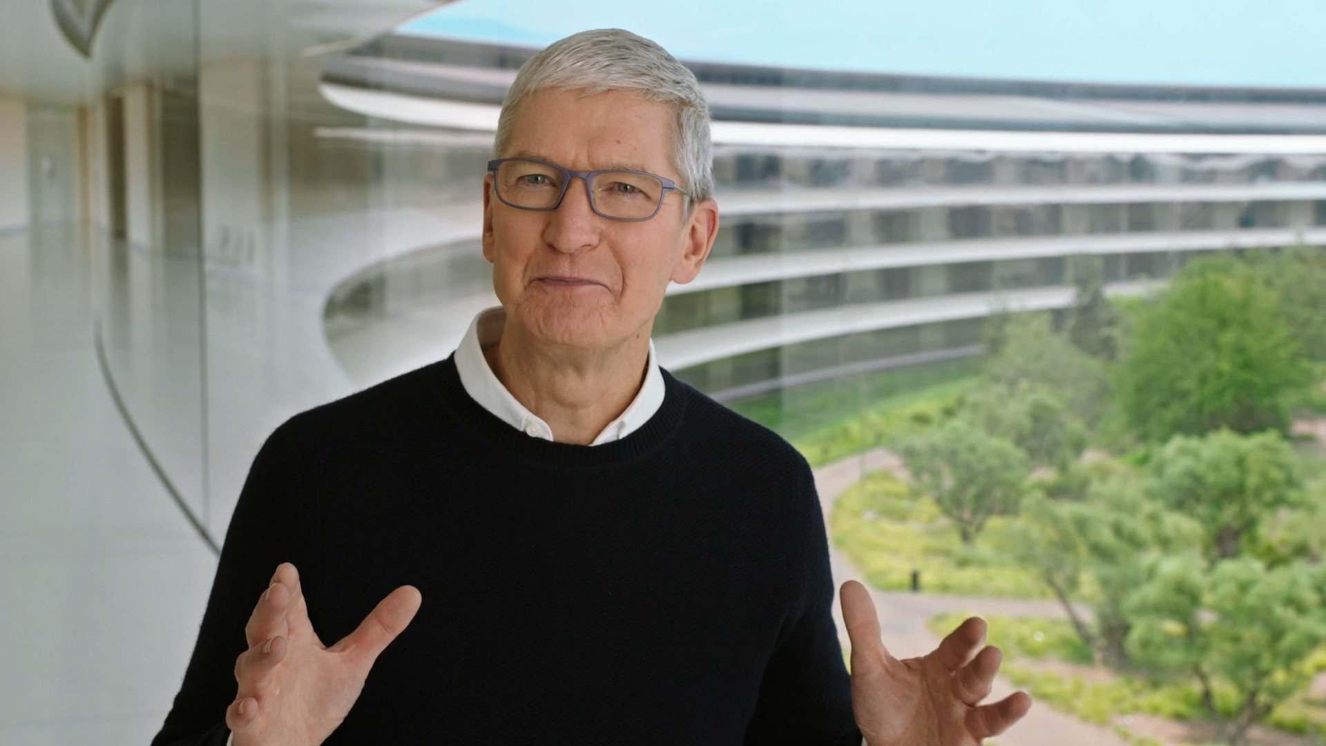 man in glasses at modern building