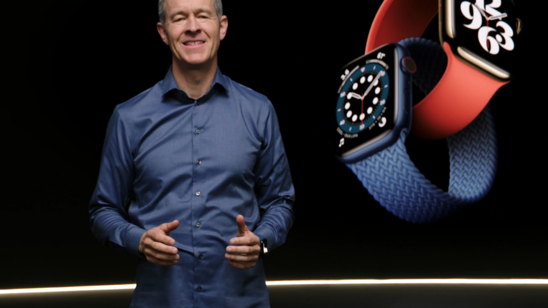 man presenting smartwatches