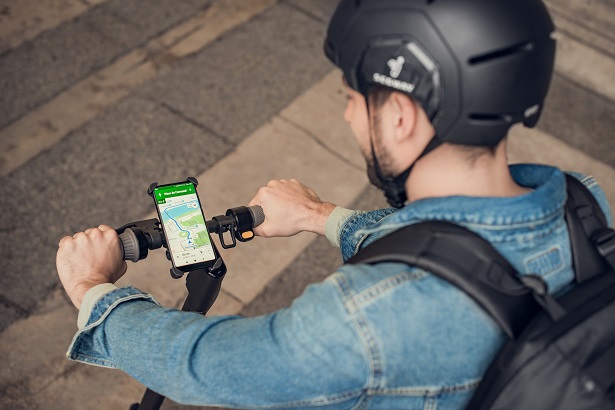 man riding electric scooter