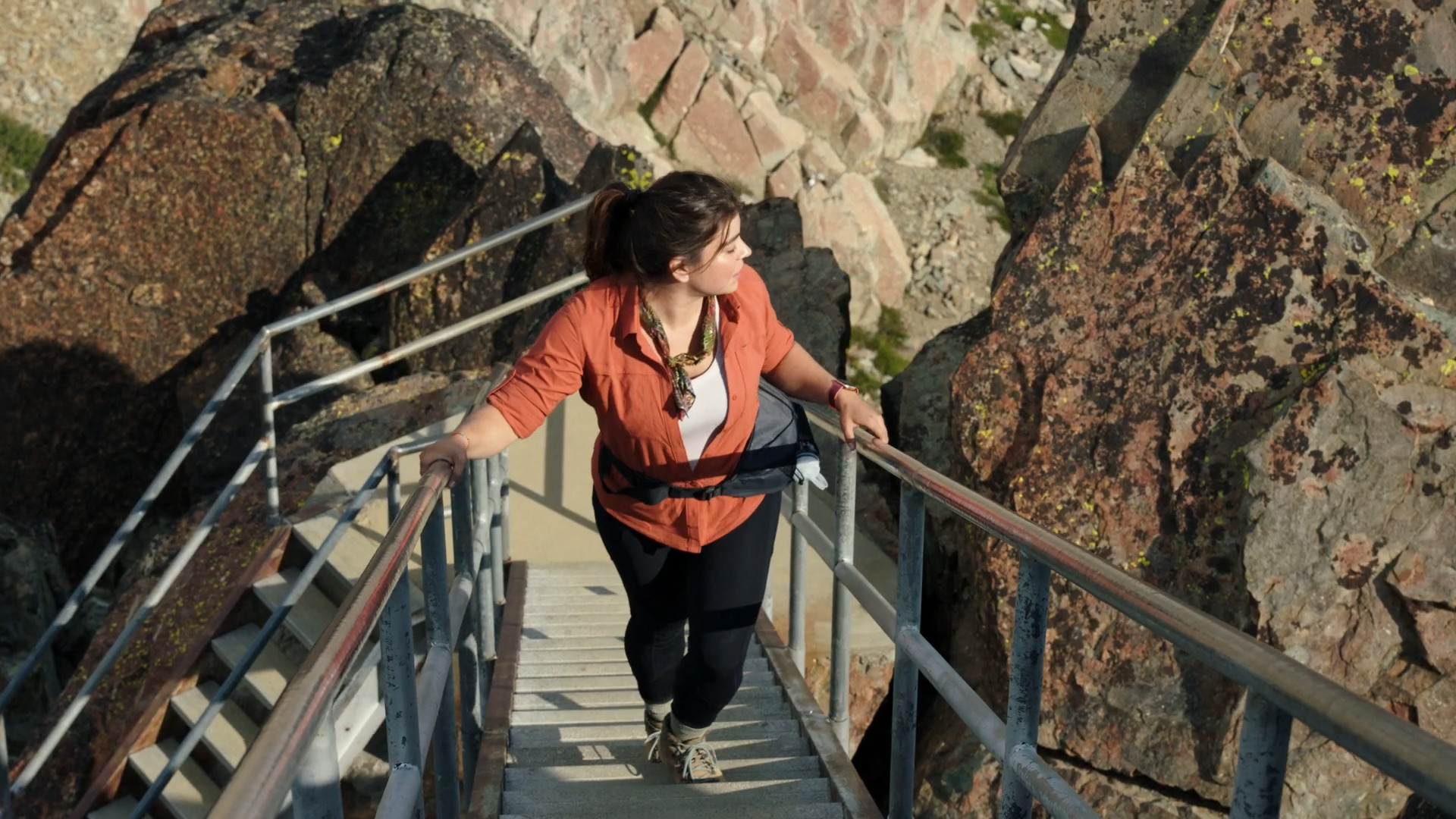 woman climbing mountain stairs