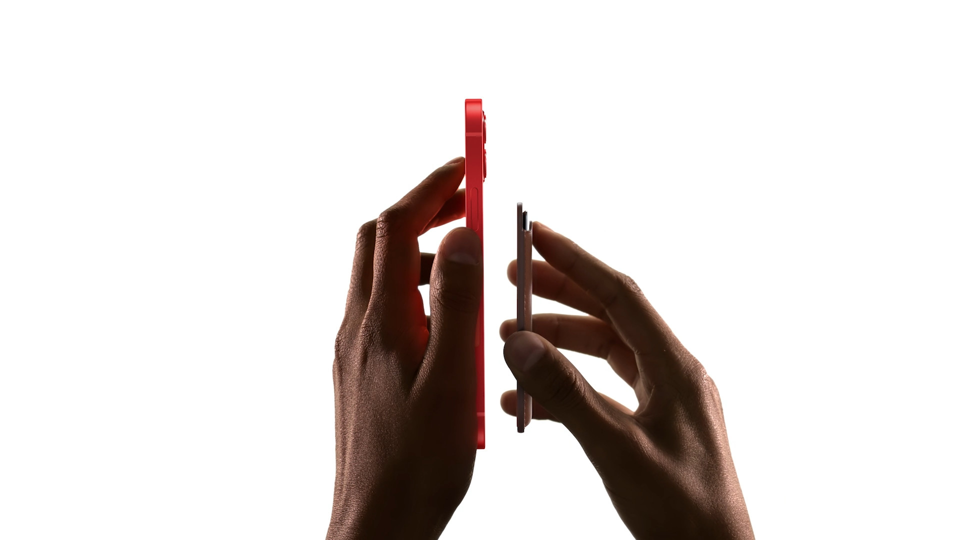 hand holding red and black phones