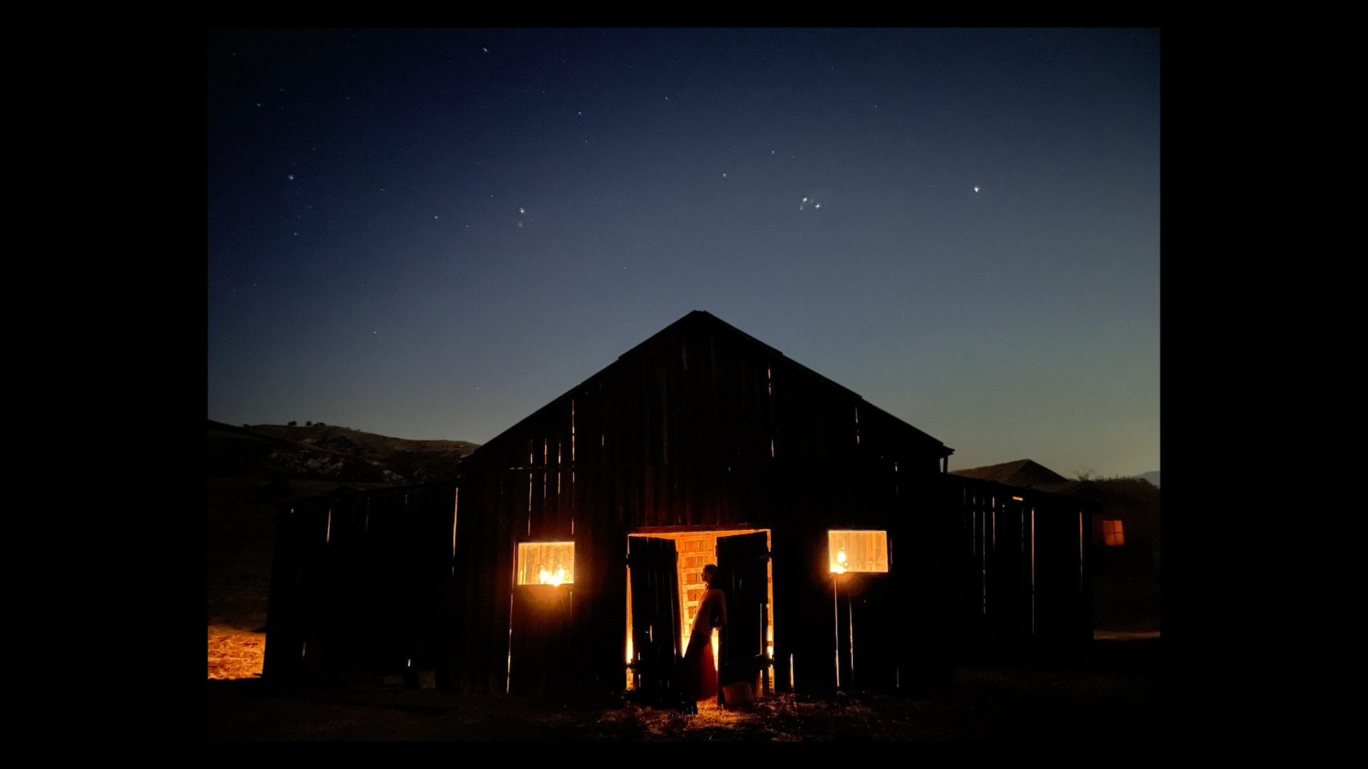 illuminated barn at night