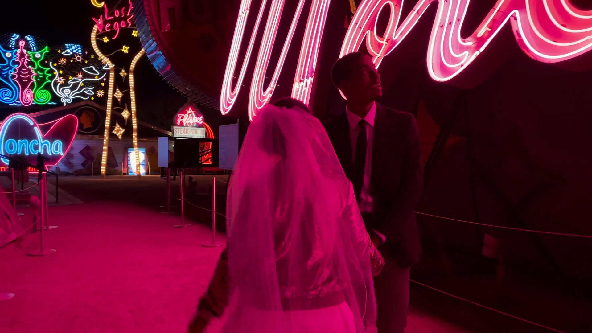 neon lights couple walking