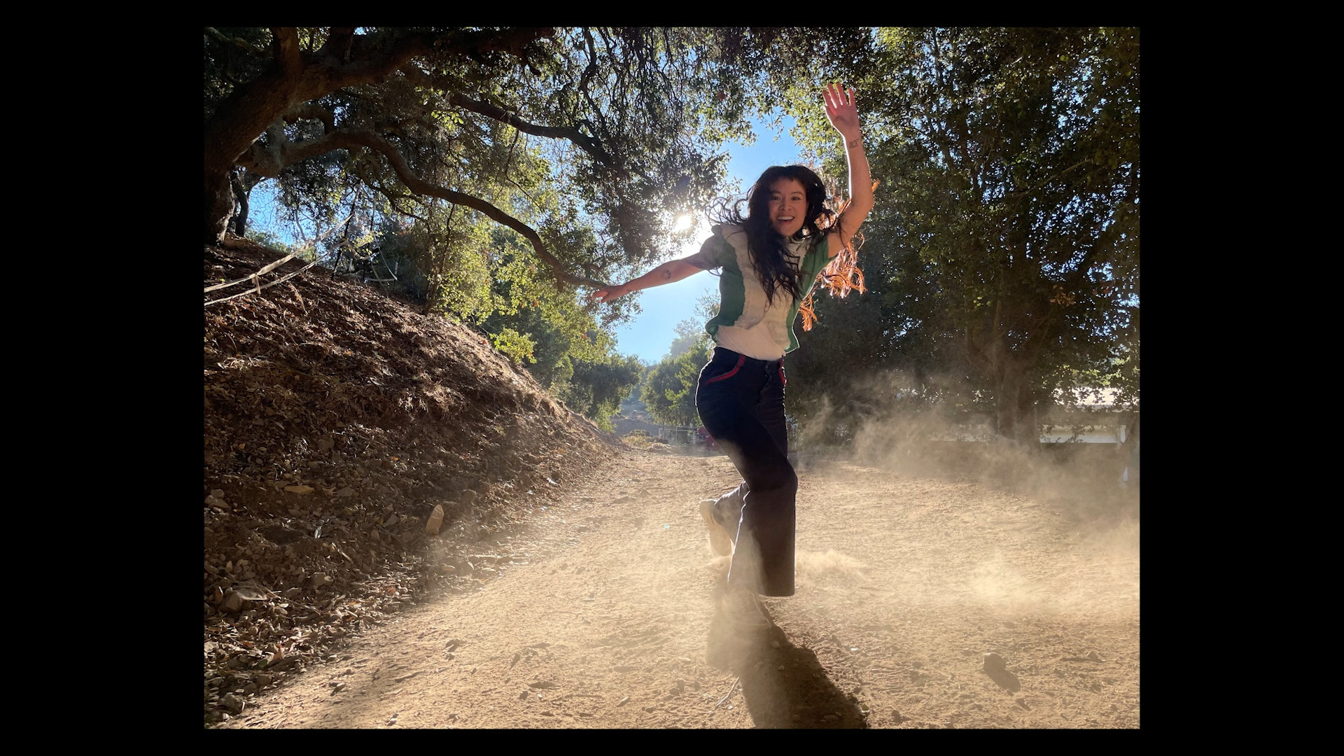 person running on dusty path