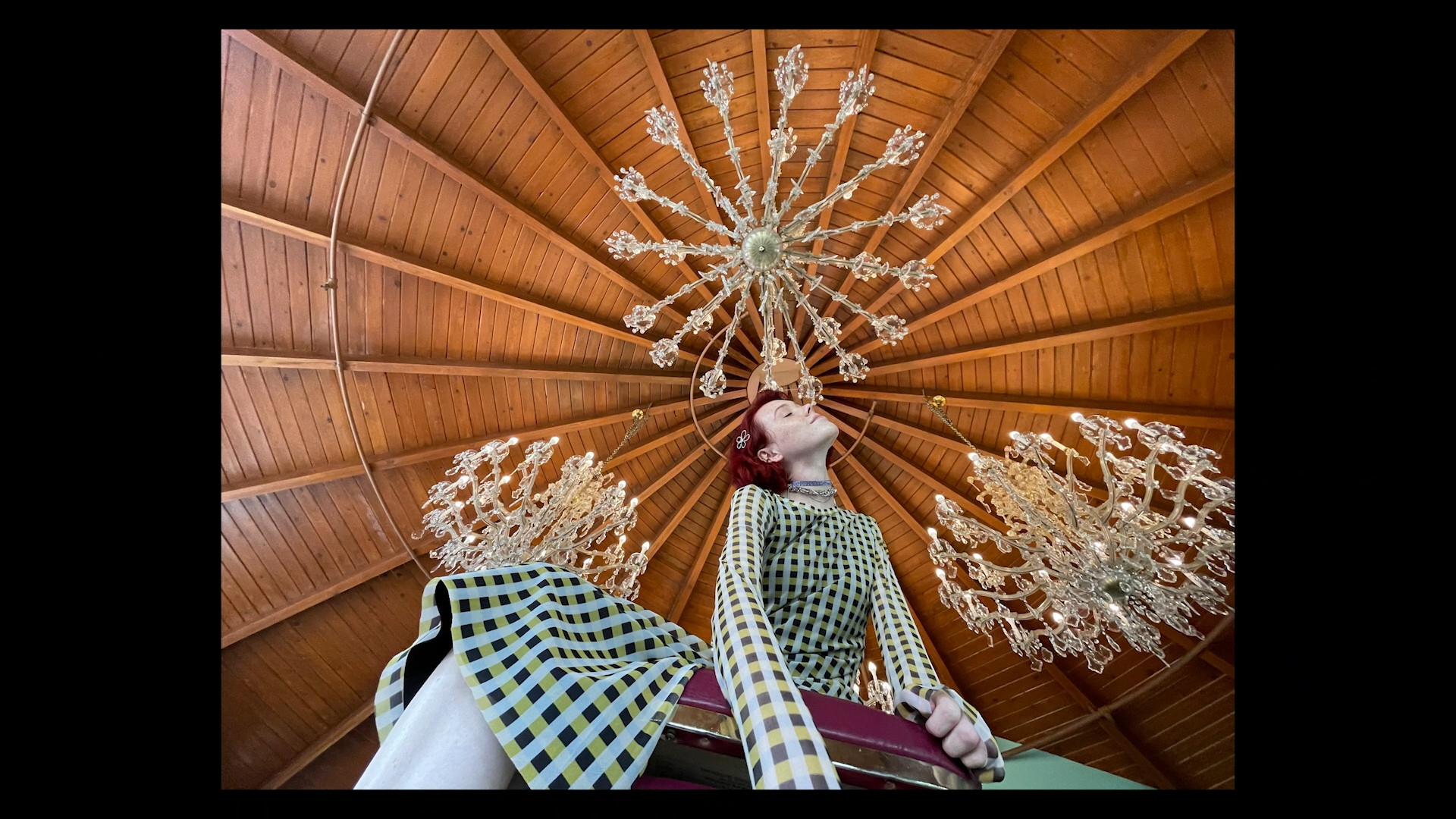 person under chandeliers