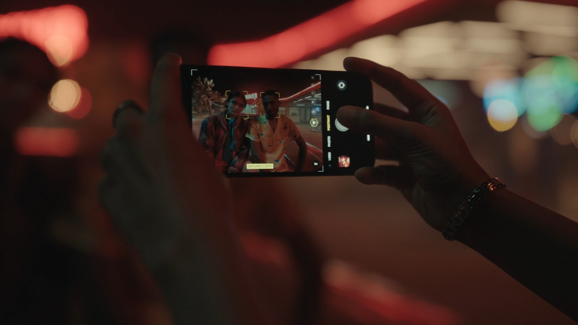 taking photo of friends at night