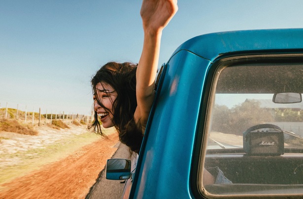 woman enjoying ride in truck