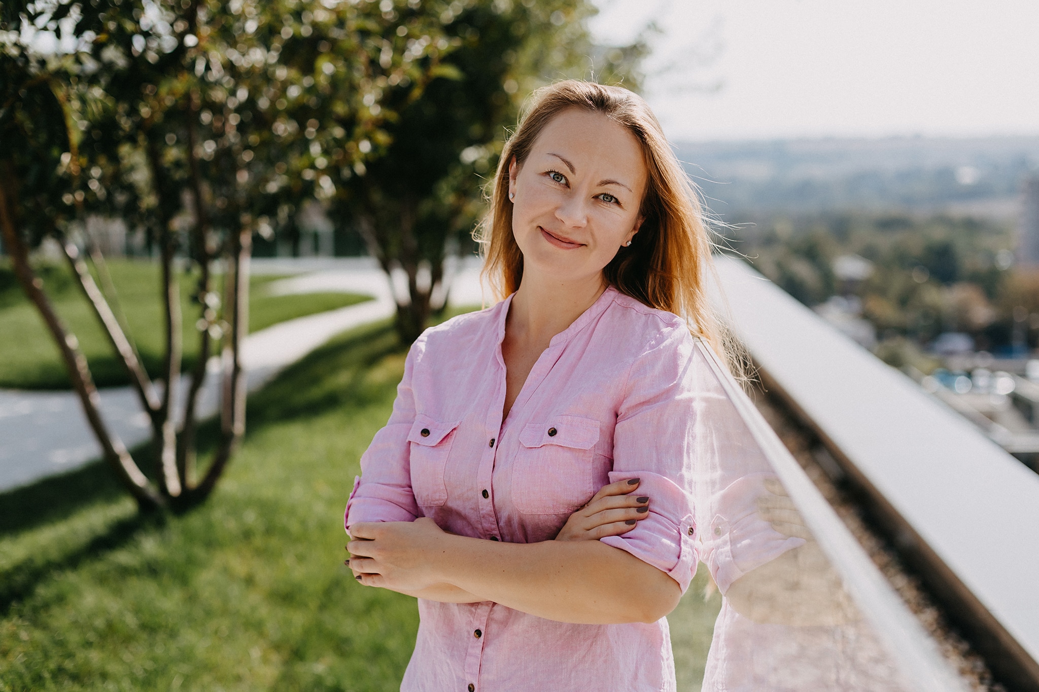 woman in pink shirt outdoors