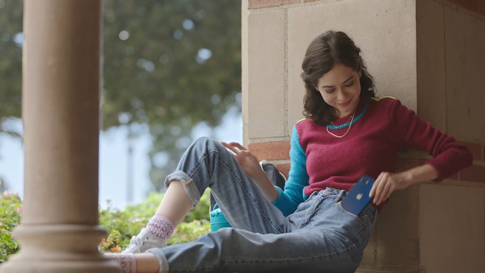 young woman relaxing with phone