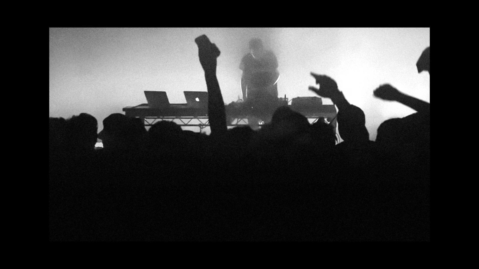 dj performing with crowd