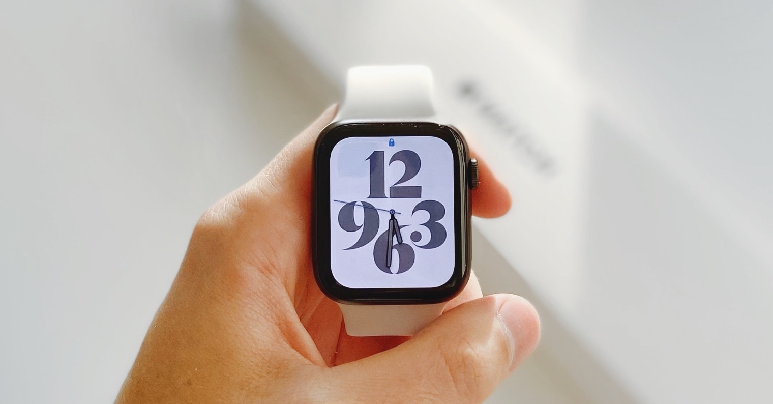 hand holding smartwatch