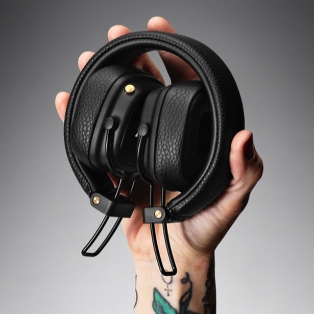 holding folded headphones