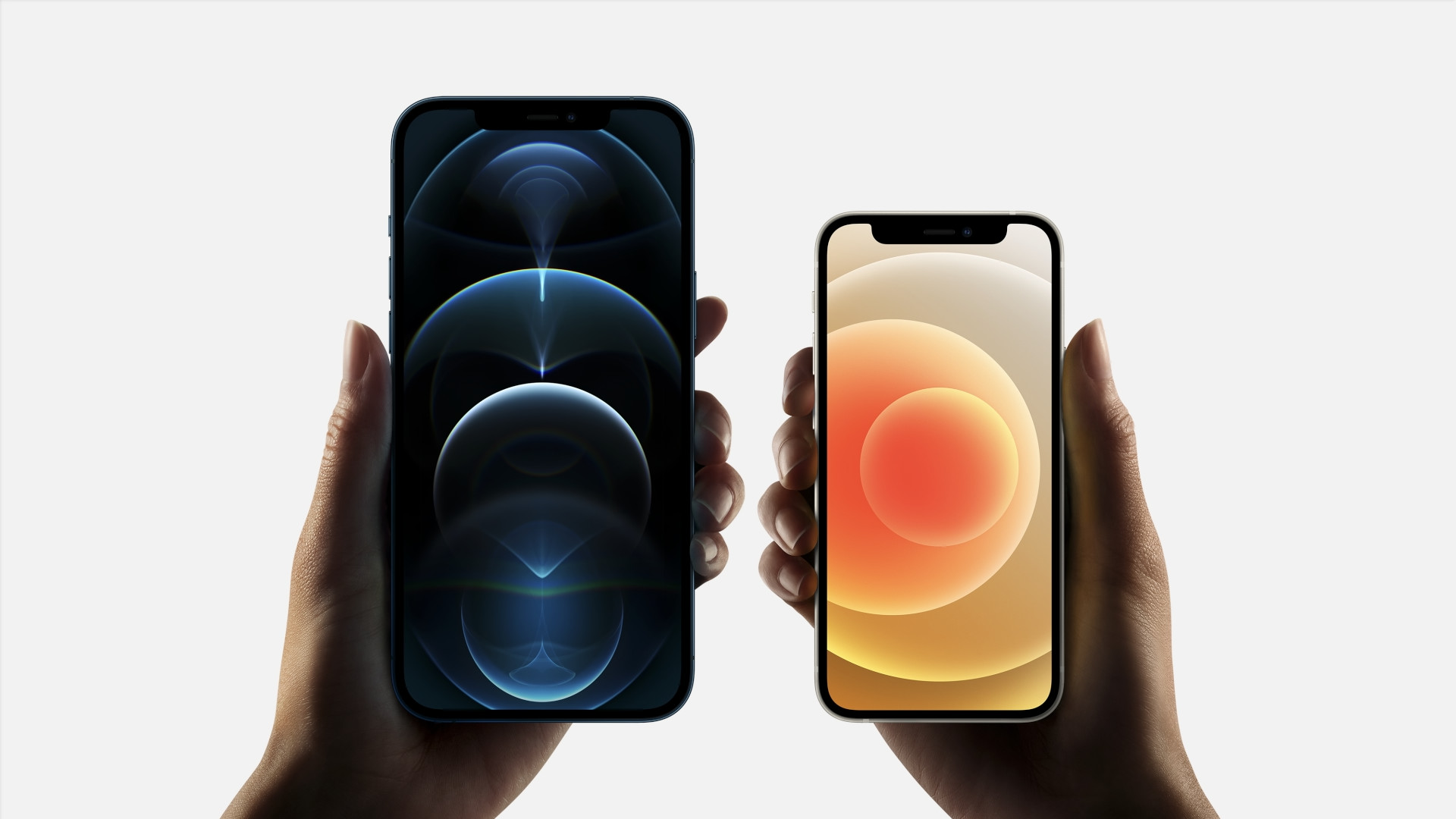 holding two smartphones