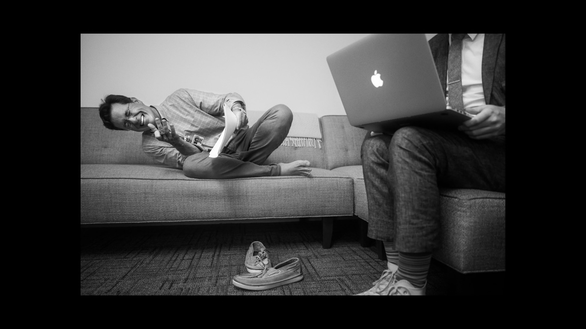 man on couch with laptop