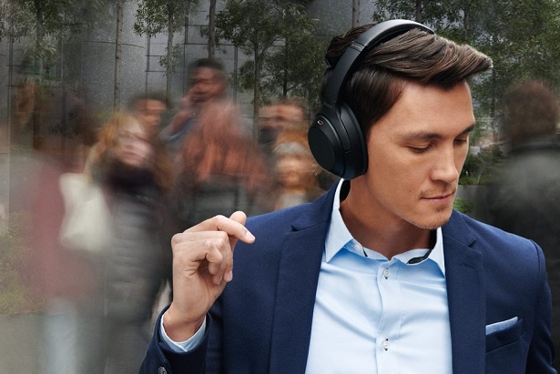 man wearing headphones in crowd