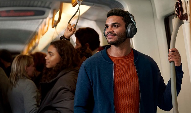 man wearing headphones on train