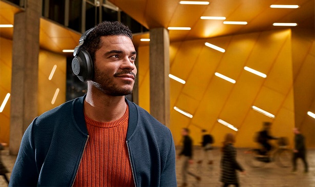 man with headphones in urban setting