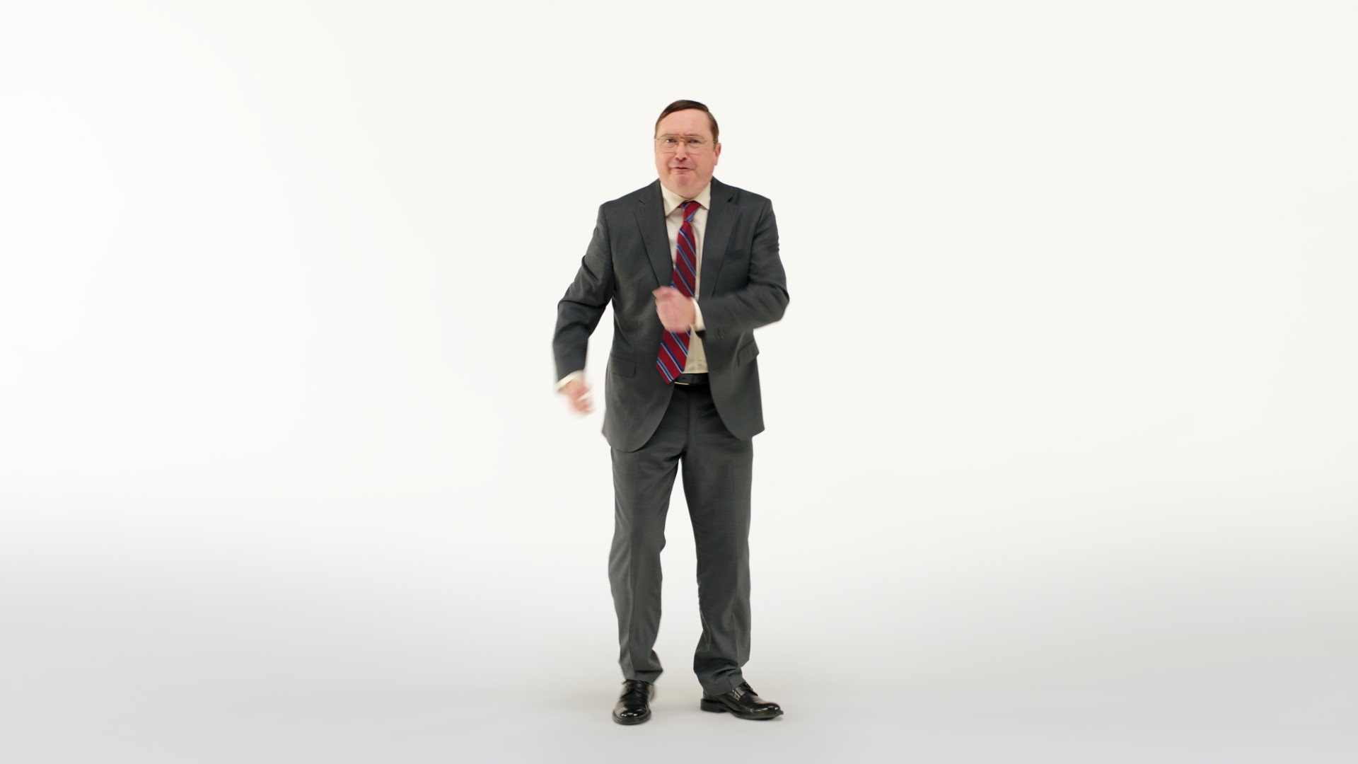 person in suit gesturing