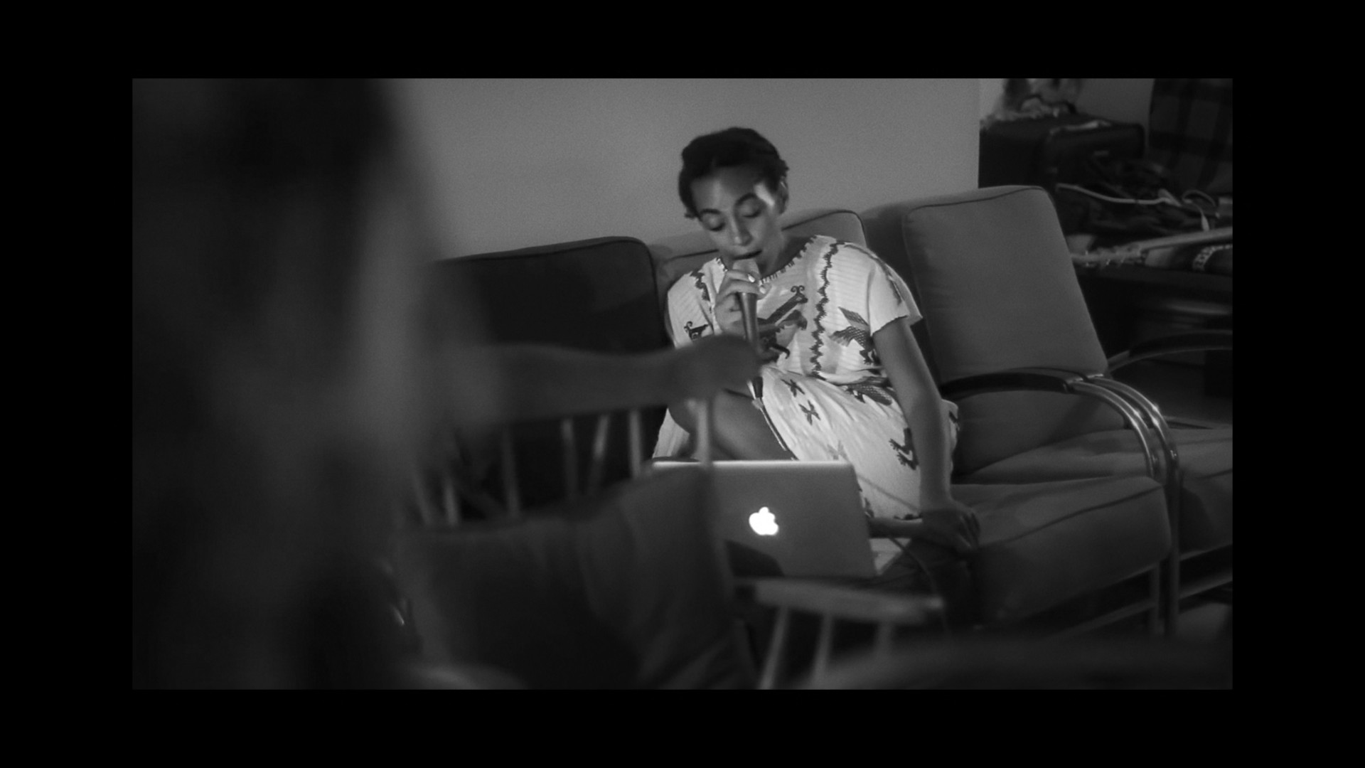 person on couch with laptop