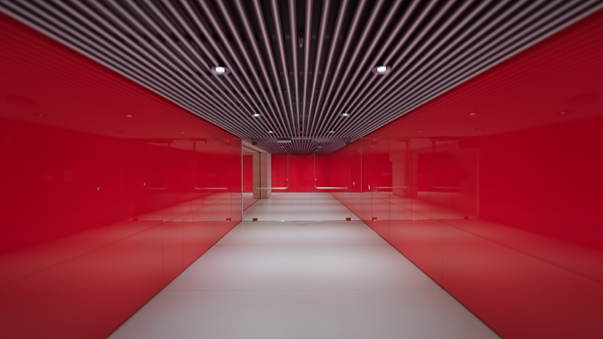 red hallway with striped ceiling