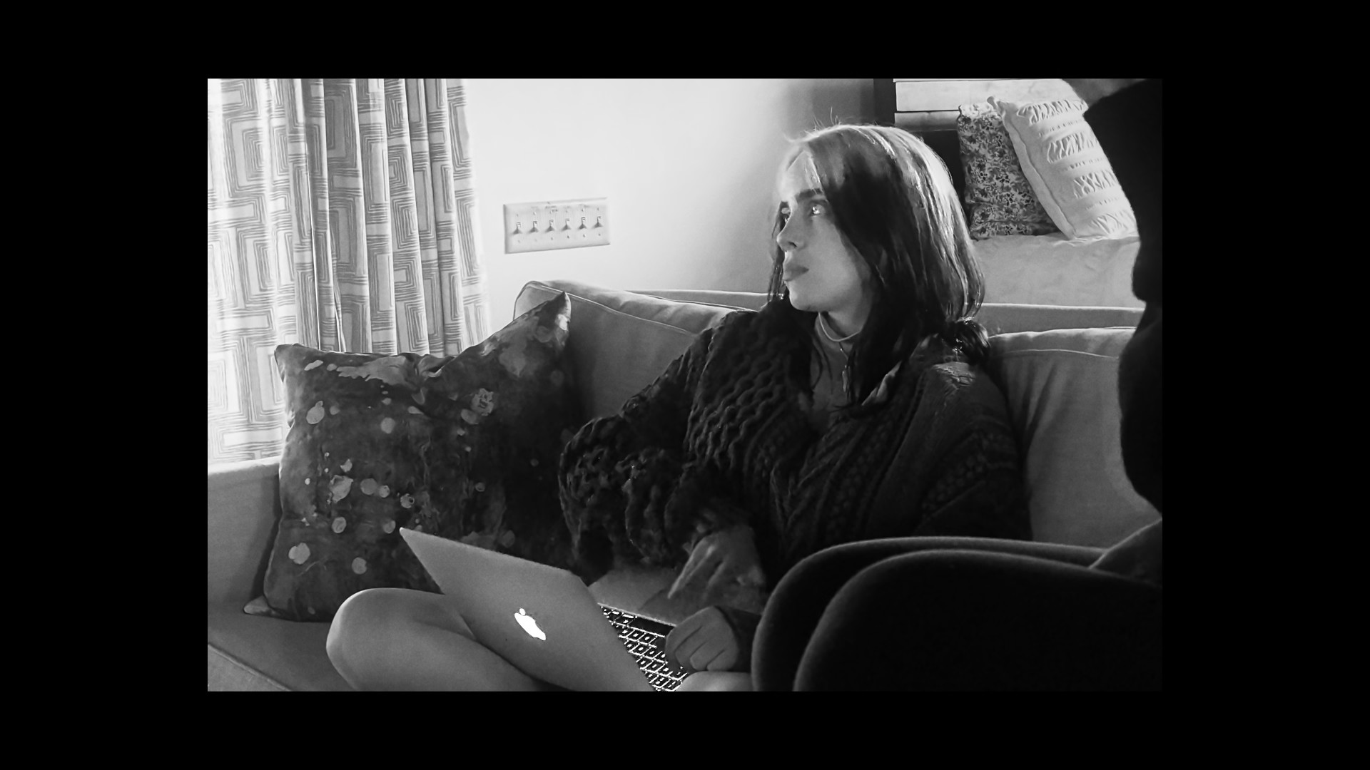 woman on couch with laptop