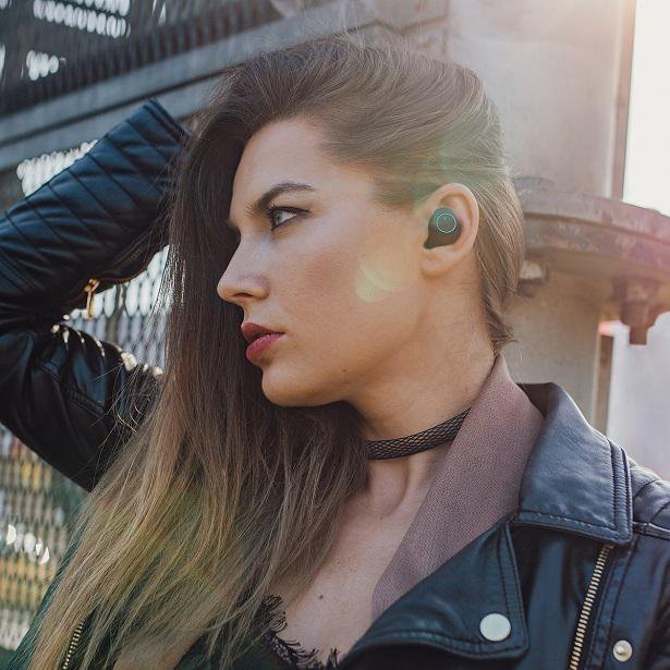 woman with earbuds and leather jacket