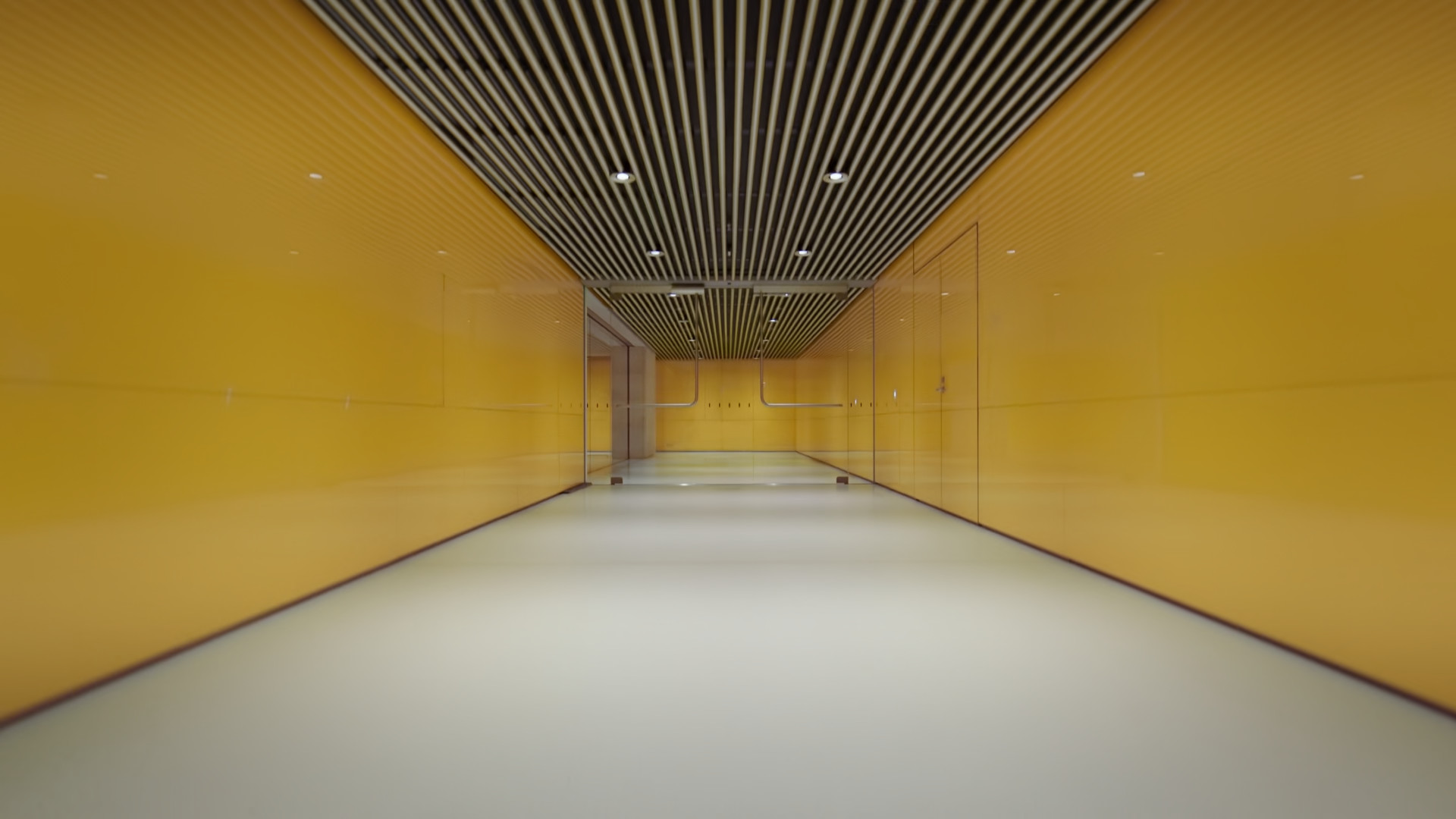 yellow hallway with striped ceiling
