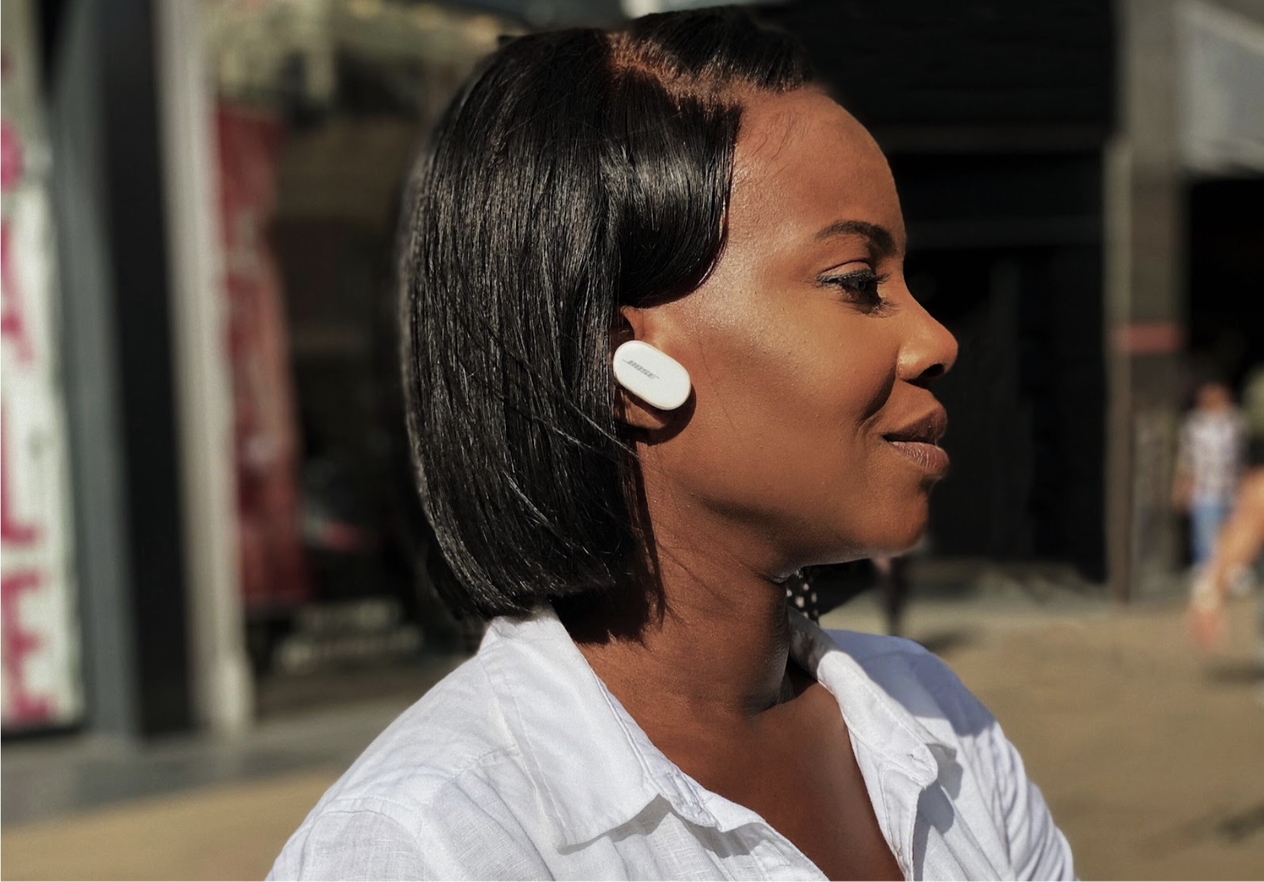 person wearing white earbud