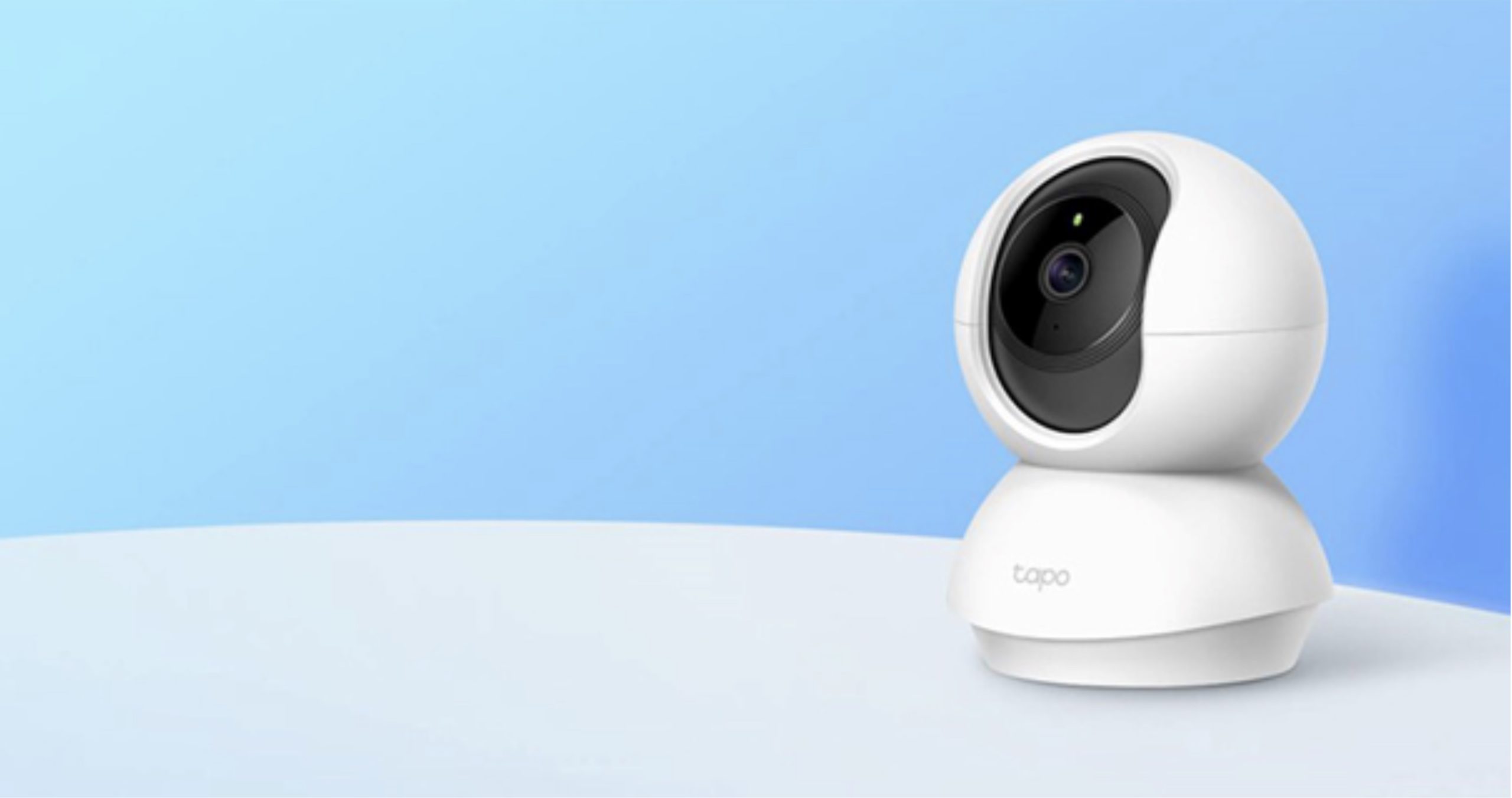 white security camera on blue background