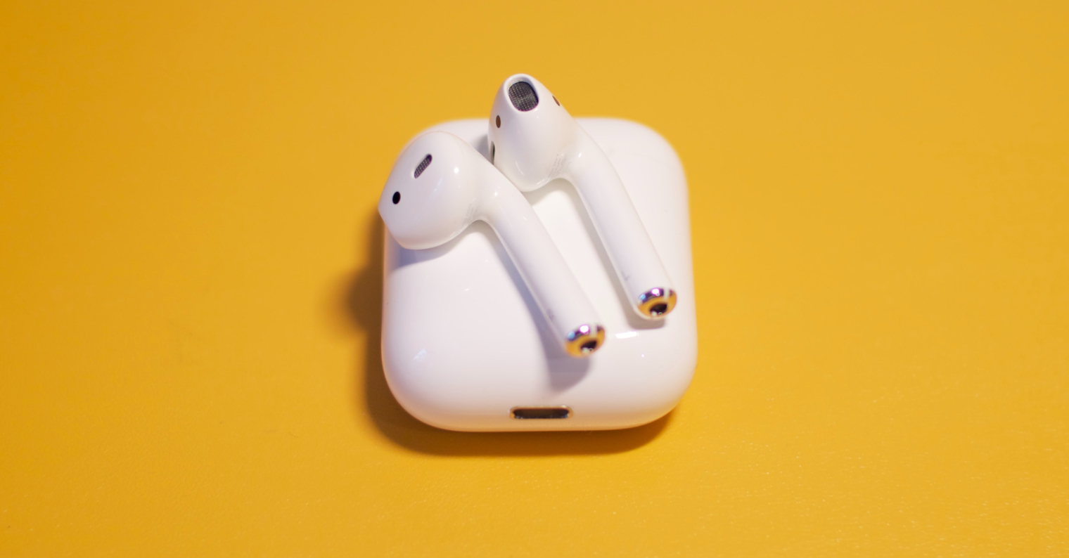 airpods on yellow background