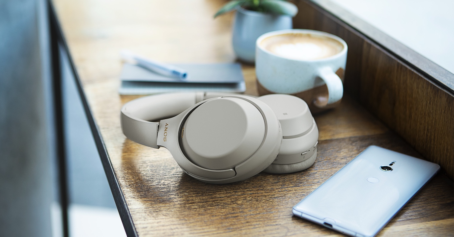 headphones coffee smartphone on table