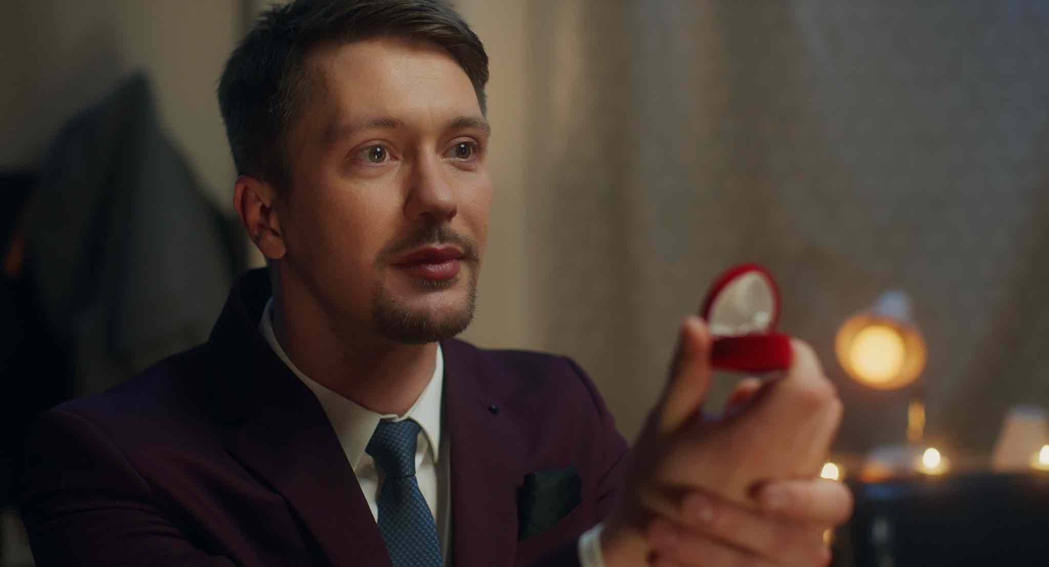 man proposing with ring