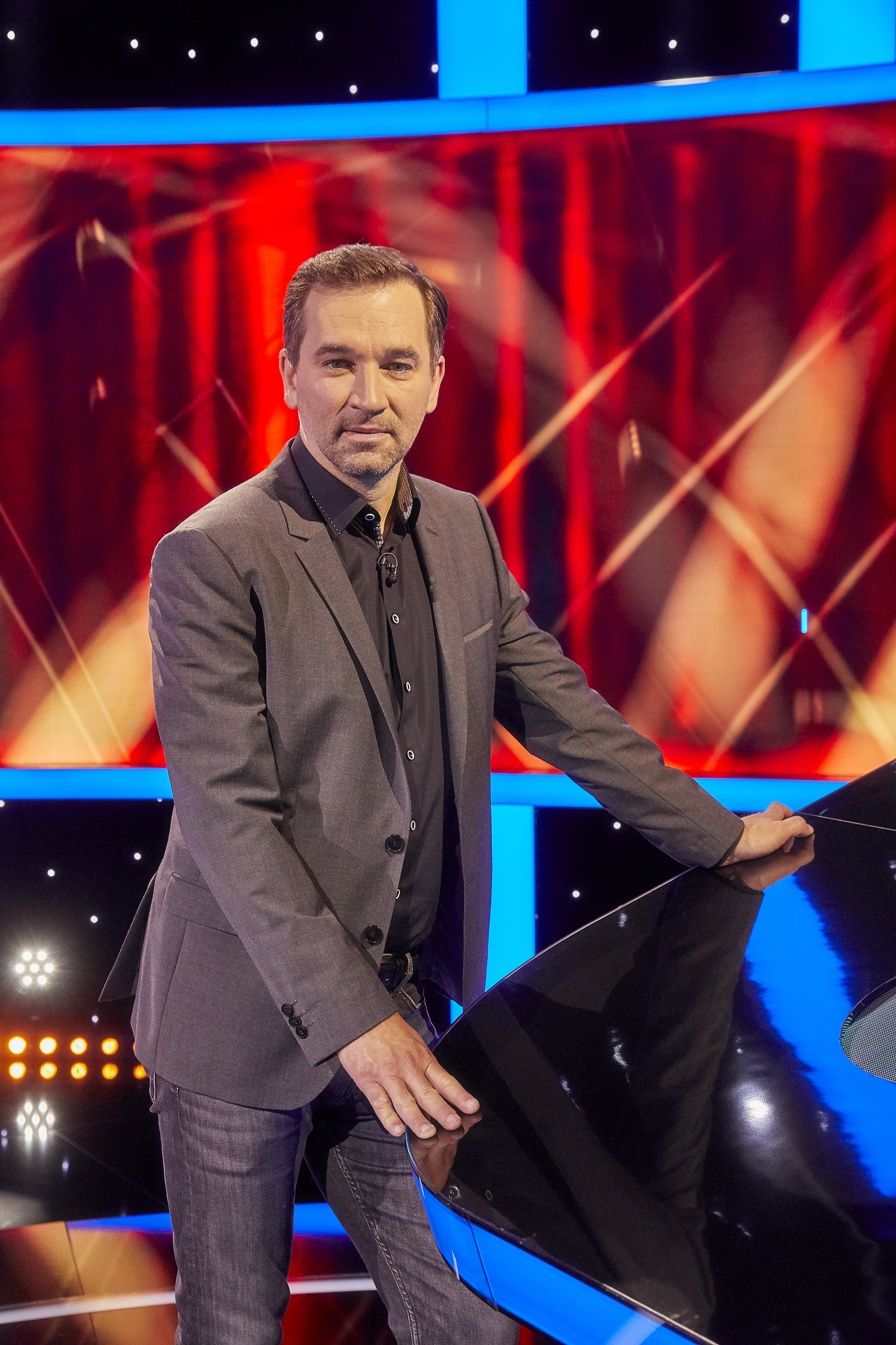 man on game show stage